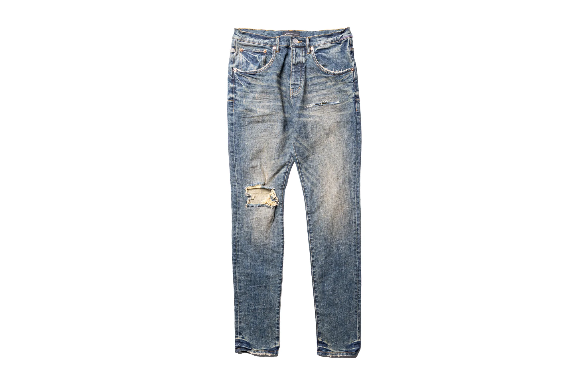 https://coveredinsauce.com/wp-content/uploads/2022/11/Covered-In-Sauce-Clothing-Purple-Brand-Mid-Rise-Slime-Jean-Distressed-Dirty-Indigo-Blowout2.webp